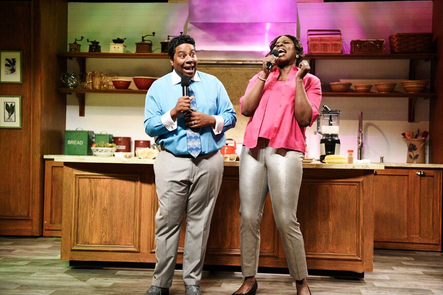 Kenan Thompson and Leslie Jones singing together during the Gospel Brunch skit on Saturday Night Live.