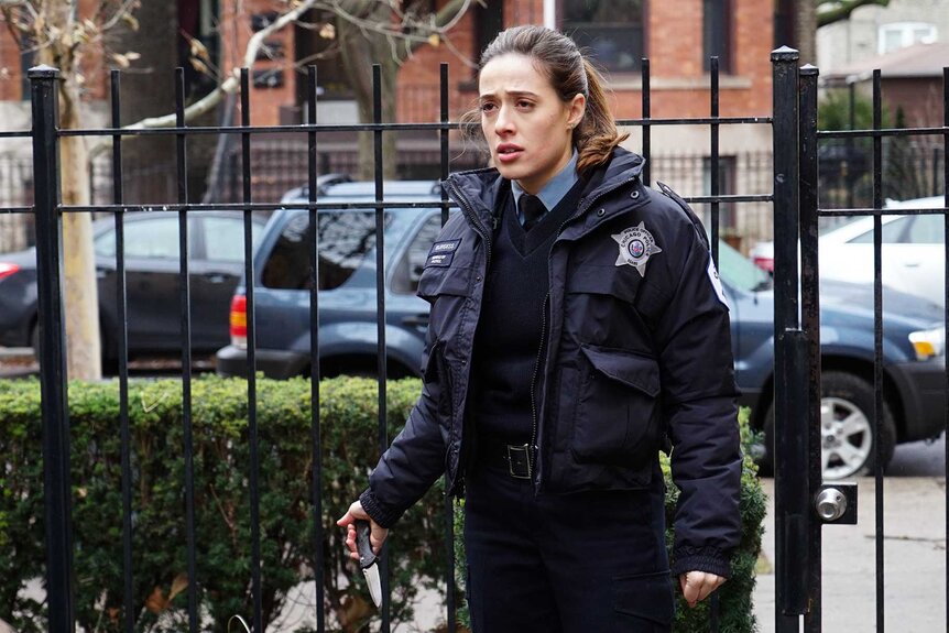 Officer Kim Burgess dressed in uniform with a concerned look on her face.