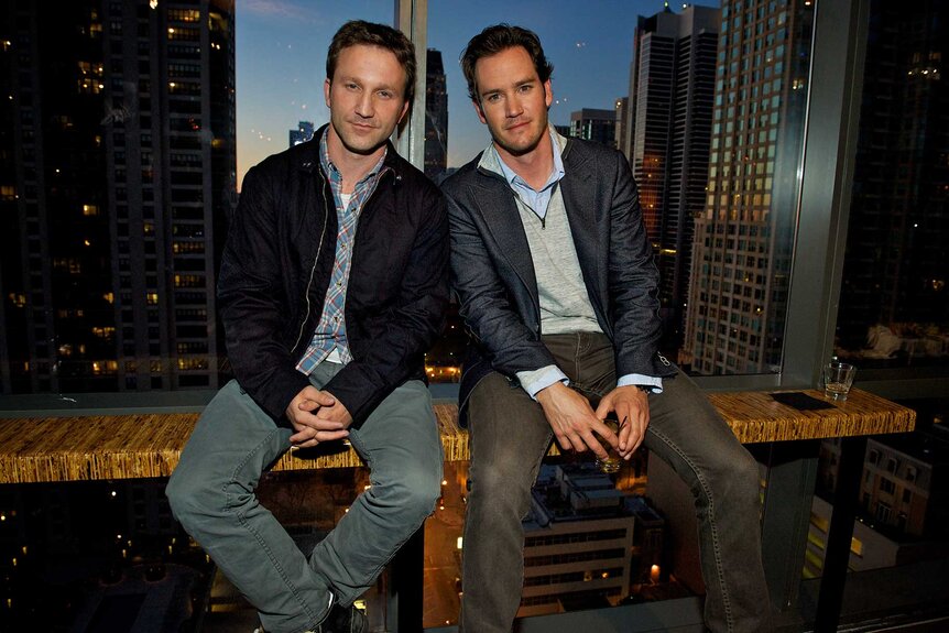 Breckin Meyer and Mark-Paul Gosselaar sitting together at the screening of Franklin & Bash.