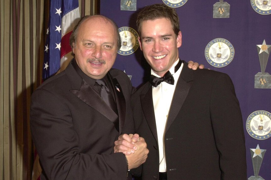 Dennis Franz and Mark-Paul Gosselaar shake hands during 7th American Veteran Awards