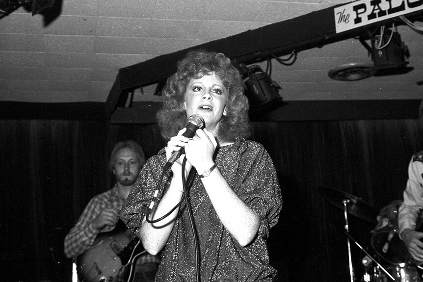 Reba McEntire performing at The Palomino along with her bandmates.