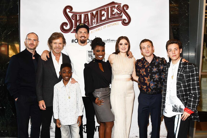 Richard Flood, William H. Macy, Christian Isaiah, Steve Howey, Shanola Hampton, Emma Kenney, Jeremy Allen White and Ethan Cutkosky posing together at the Shameless Season 9 premiere party.