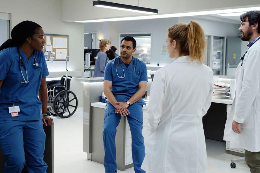 June Curtis Bashir Hamed Magalie Leblanc Theo Hunter sit and talk in the hospital