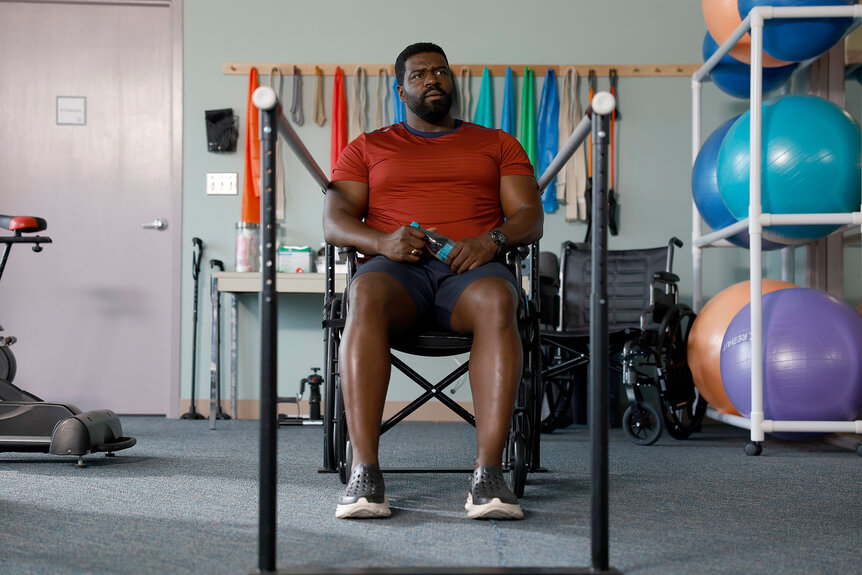 Theodore "TC" Calvin sits in a physical therapy chair