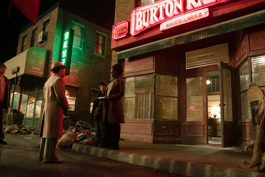 Orphan Master (Dan Li), Weiko (Roy Hu), and Lou (Jessica Allain) stand on a street curb together