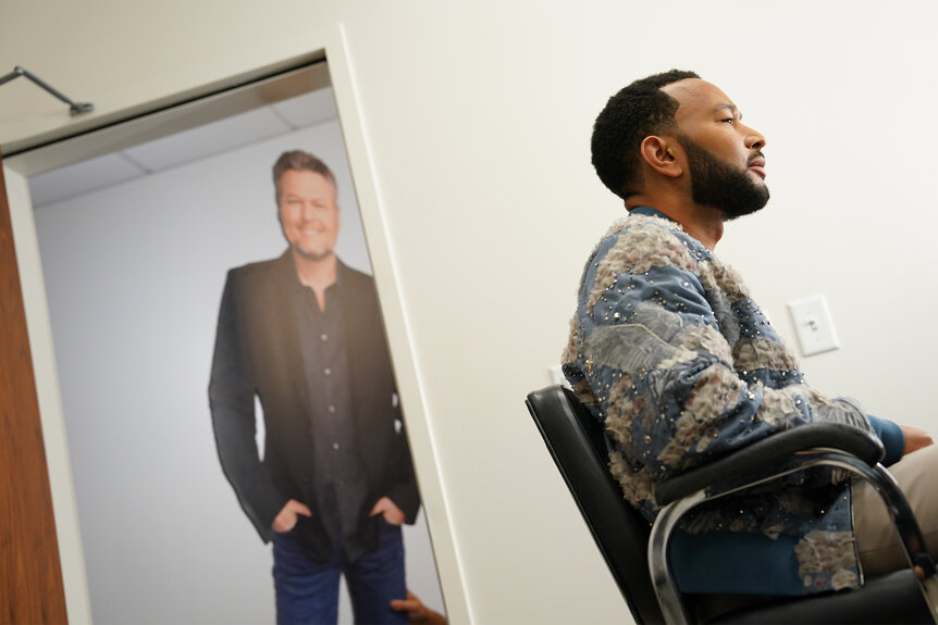 John Legend with a cutout of Blake Shelton