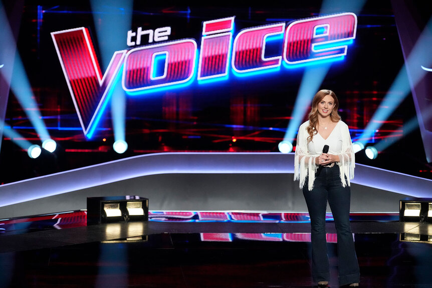 Caitlin Quisenberry stands onstage during a taping of The Voice