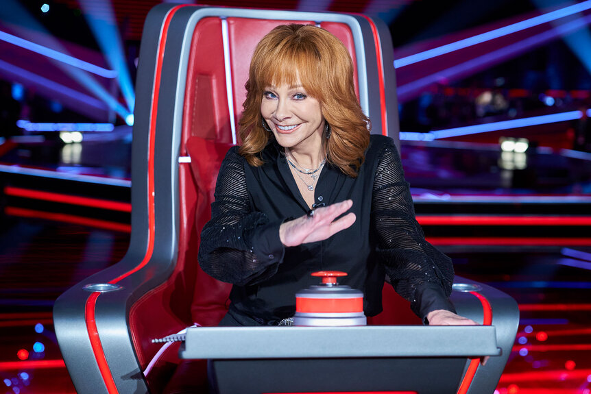 Reba McEntire sits during Season 24, Episode 6 of The Voice.