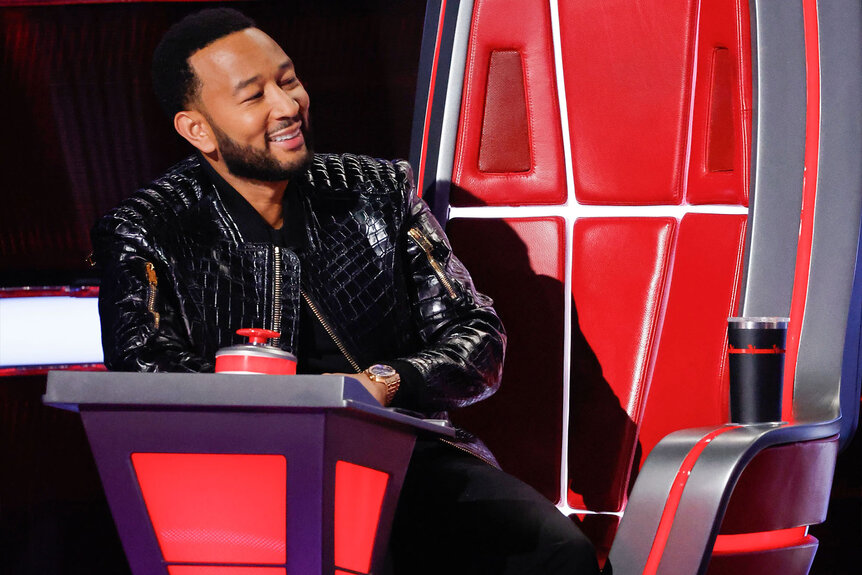 John Legend sits in his chair