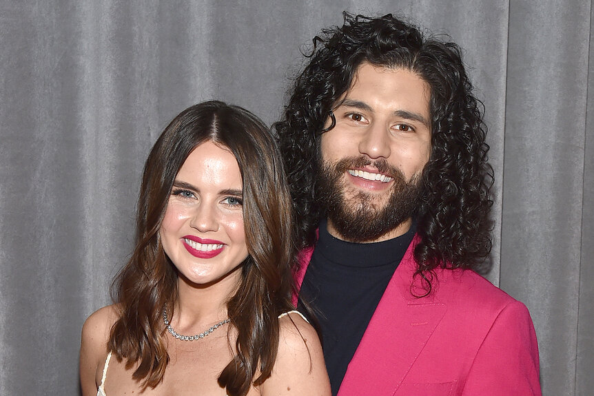 Dan and Abby Smyers pose and smile together at the Grammy's