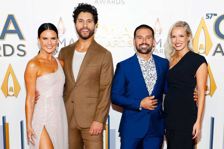 Abby Law, Dan Smyers, Shay Mooney, and Hannah Billingsley posing and smiling together on the red carpet.