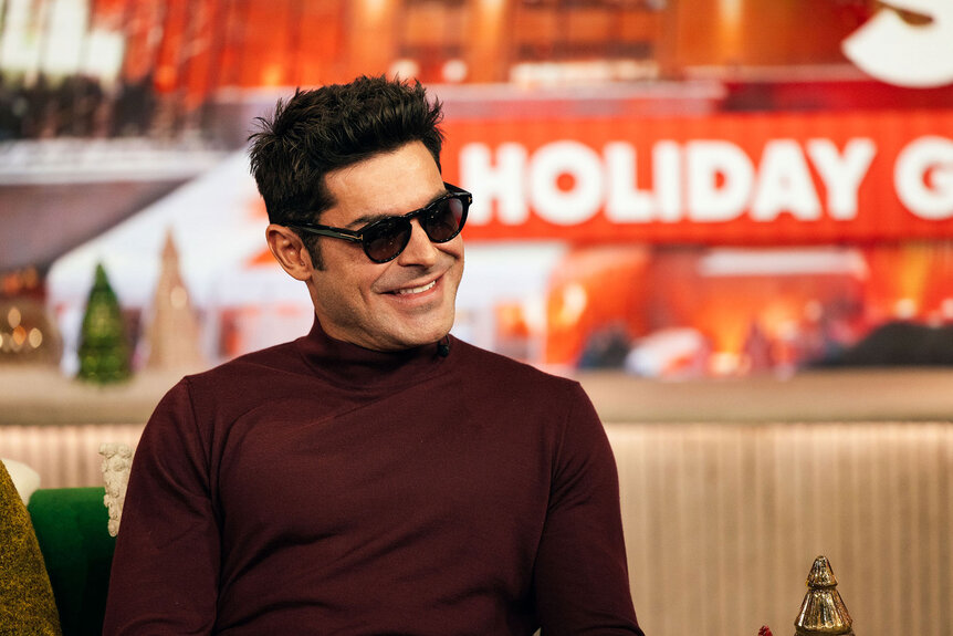 Zac Efron wears dark sunglasses on The Kelly Clarkson Show