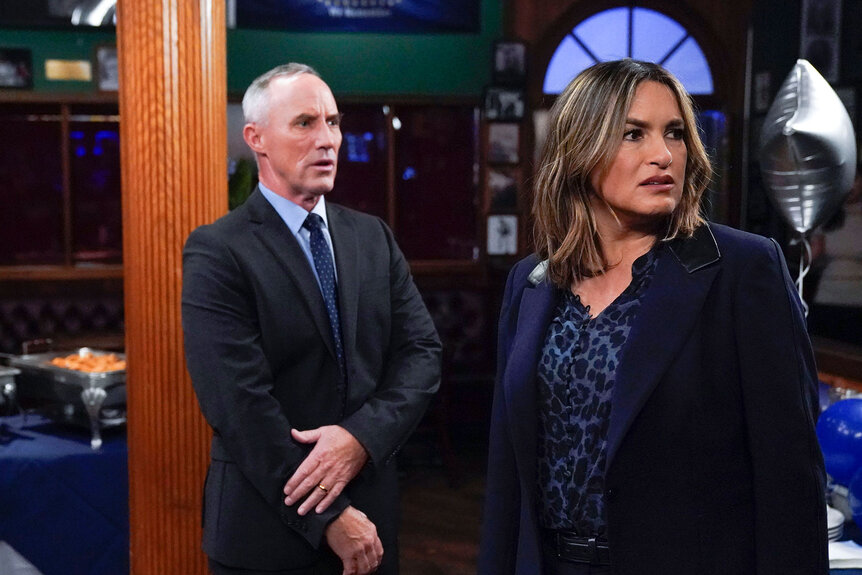 Robert John Burke as Captain Ed Tucker and Mariska Hargitay as Captain Olivia Benson