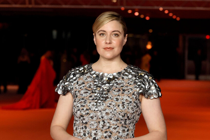 Close up of Greta Gerwig on a red carpet