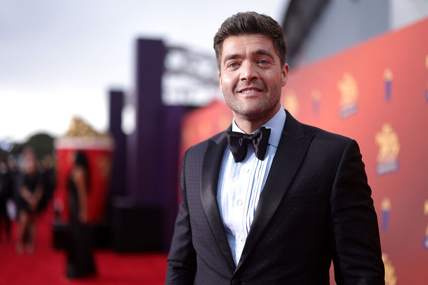 Chris Tamburello poses for a photo on the red carpet