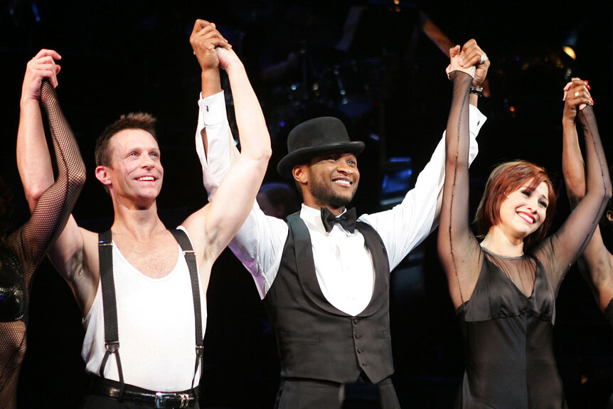 Usher and Bianca Marroquin (R) with the cast of "Chicago" take a curtain call