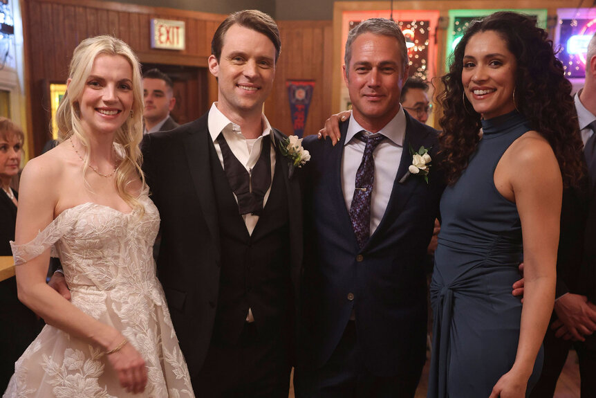 Sylvie Brett (Kara Killmer), Matt Casey (Jesse Spencer) Kelly Severide (Taylor Kinney), Stella Kidd (Miranda Rae Mayo) pose for a photo together