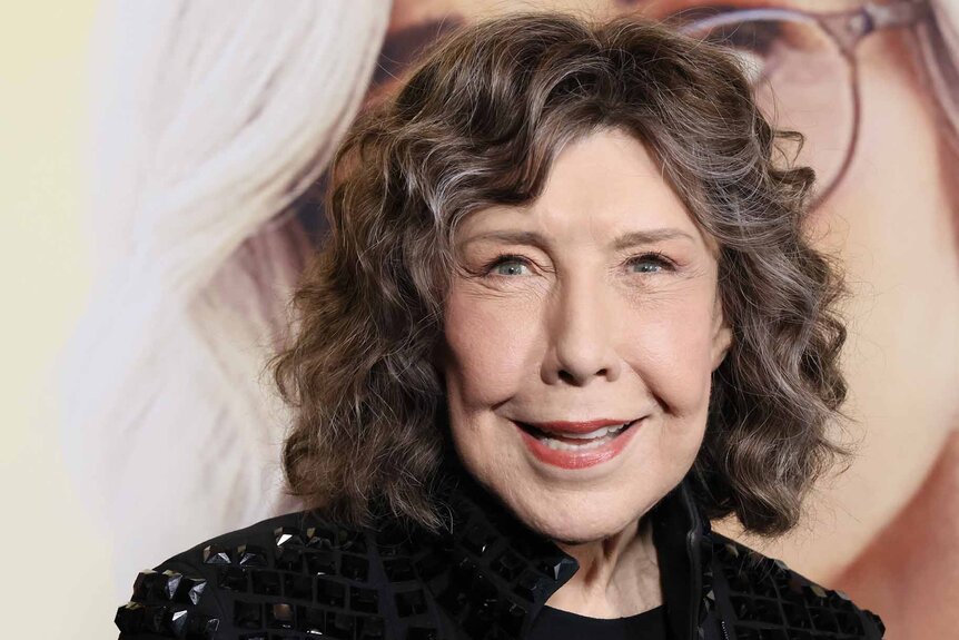 Lily Tomlin smiles.