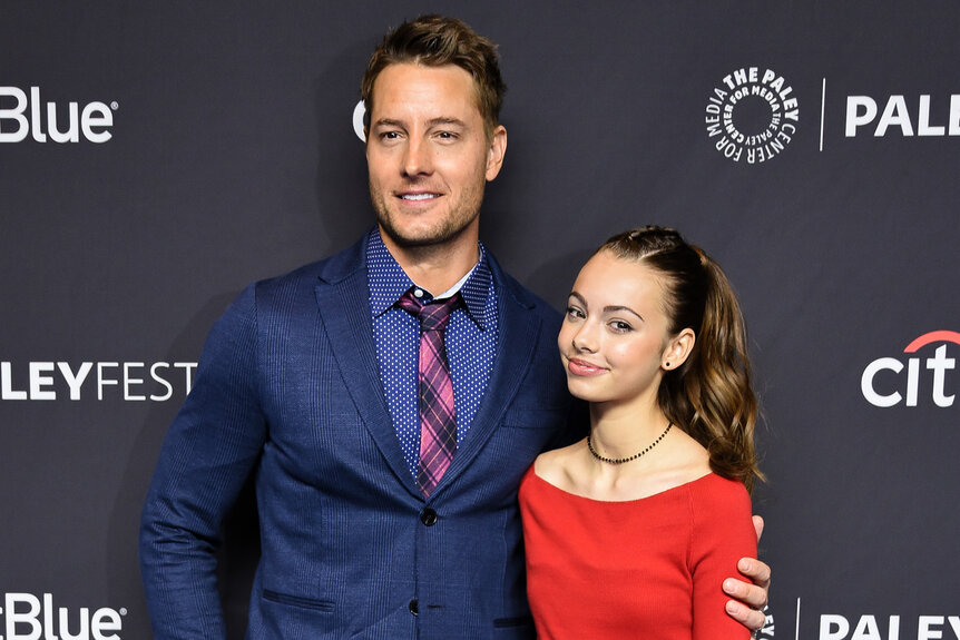 Justin Hartley and Isabella Justice Hartley stand together on the red carpet at the 2029 paleyfest