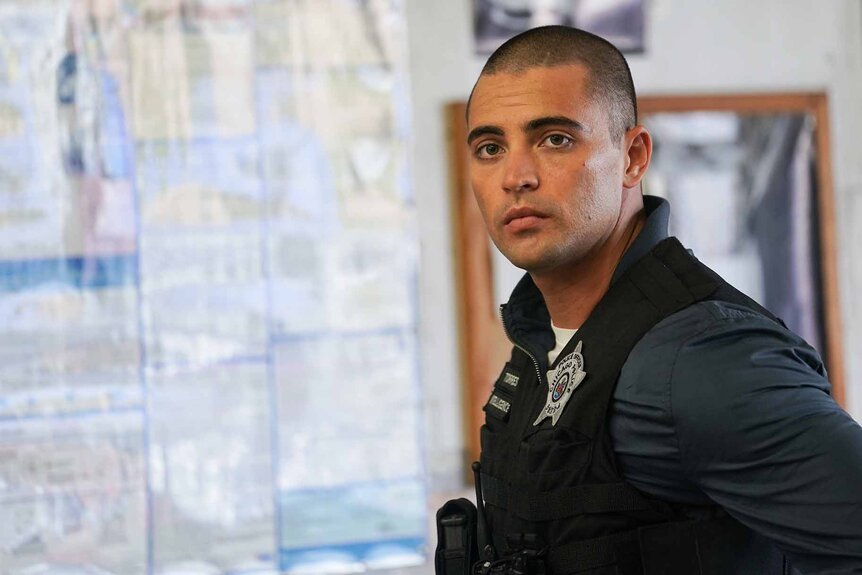 Dante Torres stands near a board in Chicago P.D. Episode 1006.