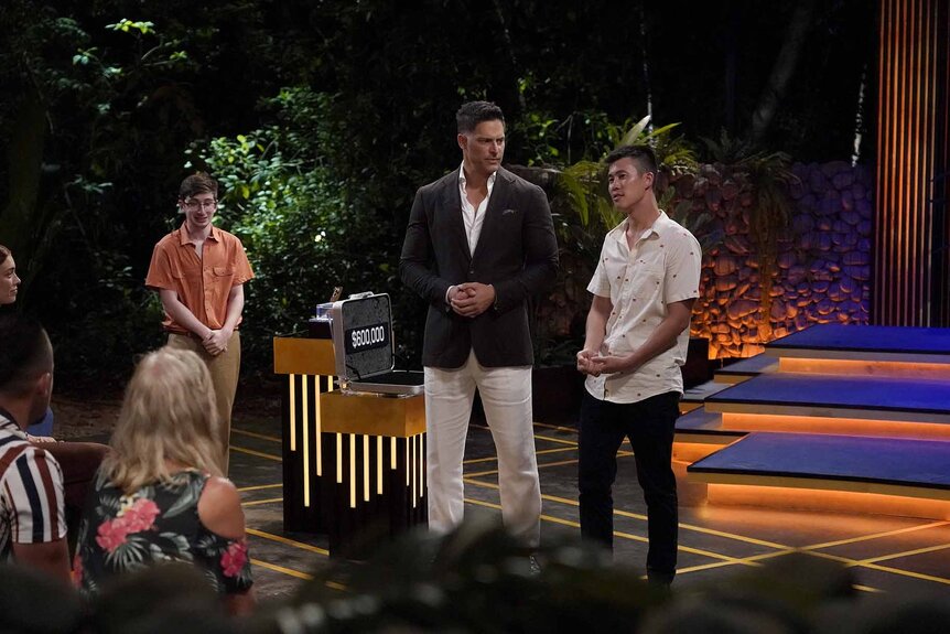 Aron Barbell, Joe Manganiello, and Brantzen Wong participate in Deal or No Deal Island Episode 101.