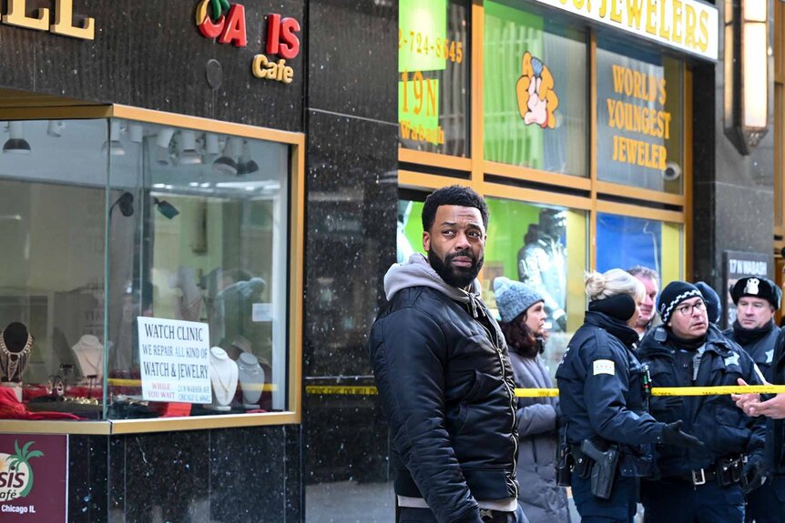 Kevin Atwater (LaRoyce Hawkins) stands near a police investigation in Chicago P.D. Season 11 Episode 5 "Split Second".