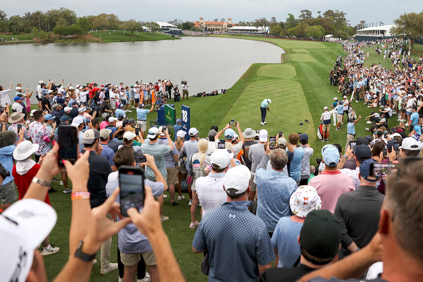 Scottie Scheffler plays his shot at the 18th tee during the final round of the players championship