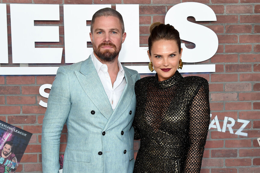 Stephen Amell and Cassandra Jean pose for a photo at the premiere of the new STARZ series "Heels"