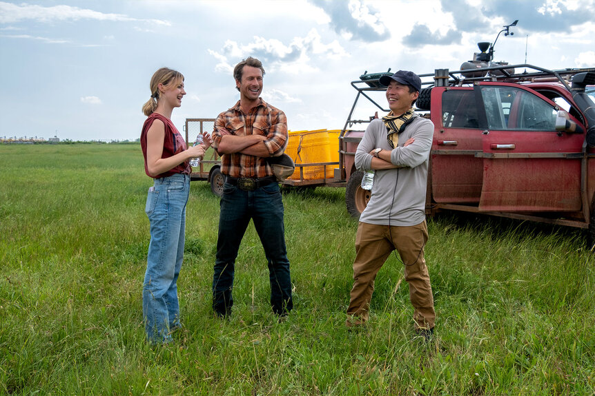 Daisy Edgar-Jones, Glen Powell, and Director Lee Isaac Chung on the set of Twisters