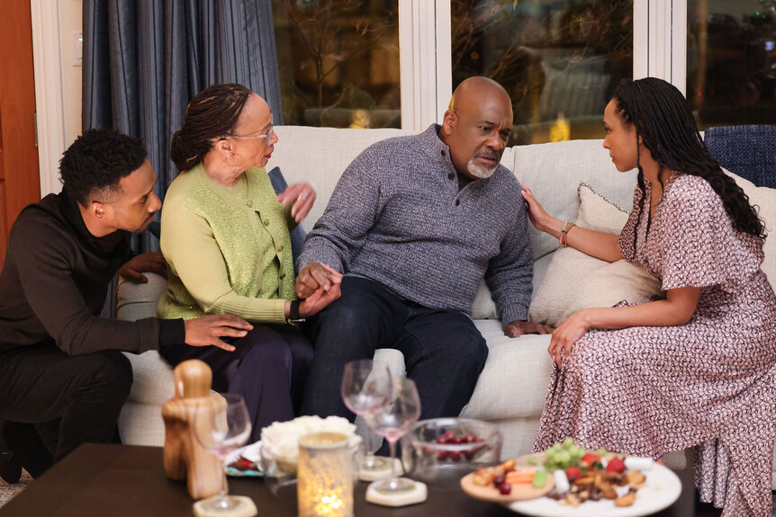 Michael, Sharon and Tara Goodwin help Bert Goodwin sit