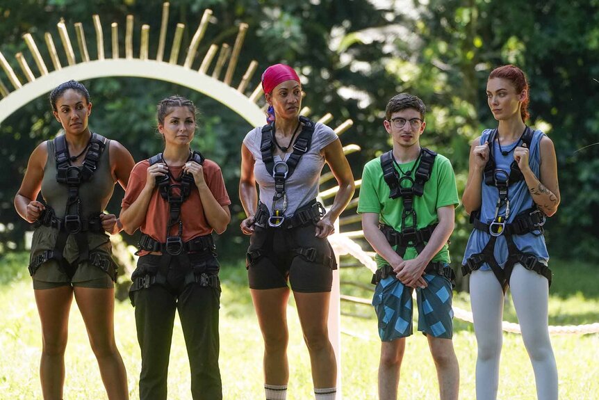 Jordan Fowler, Miranda Harrison, Stephanie Mitchell, Aron Barbell, and Alyssa Klinzing stand wearing harnesses on Deal or No Deal Island Episode 103