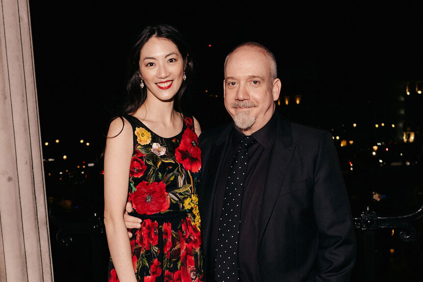 Clara Wong and Paul Giamatti pose for a photo at the Nominees' Party for the EE BAFTA Film Awards 2024