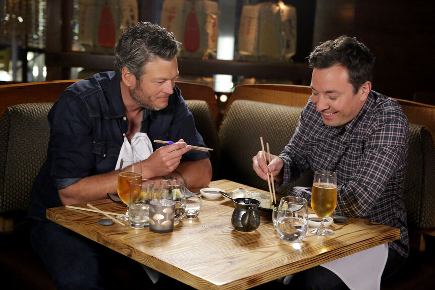 Blake Shelton and host Jimmy Fallon eat sushi during the "Jimmy Makes Blake Try Sushi" bit on May 24, 2016.