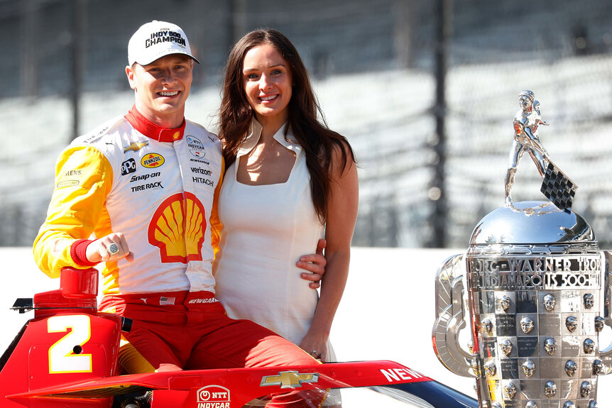 Josef Newgarden posing for a photo with his wife Ashley Newgarden after winning the 107th running of the Indianapolis 500