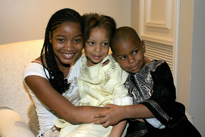 Keke Palmer, sister Lawrencia Palmer and brother Lawrence Palmer embrace at the Lions Gate Films cocktail reception for the film "Akeelah and the Bee"