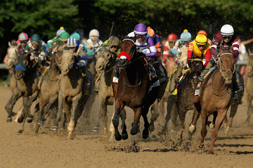 Nyquist, ridden by Mario Gutierrez, and Gun Runner, ridden by Florent Geroux, come out of the fourth turn during the 142nd running of the Kentucky Derby