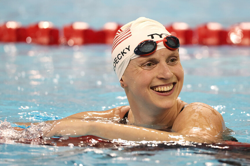 Katie Ledecky smiles after winning a race