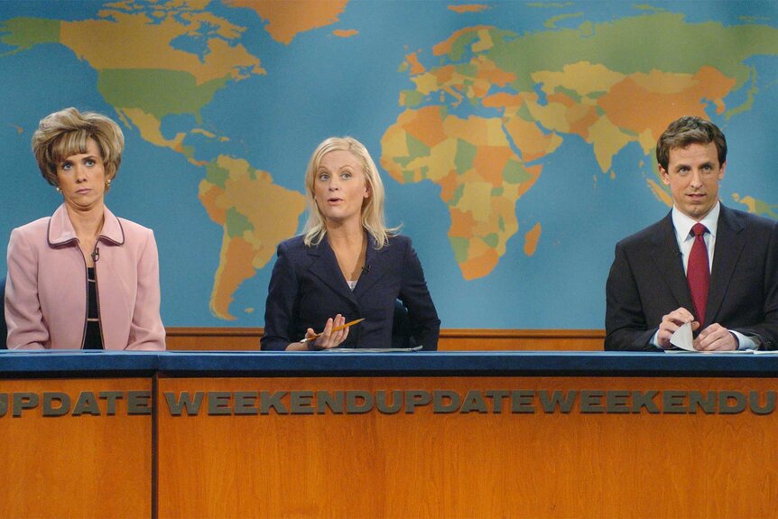 Kristen Wiig Amy Poehler and Seth Meyers during weekend update on saturday night live