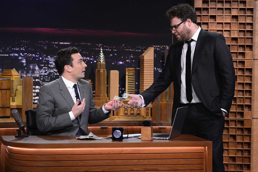 Seth Rogan hands Jimmy Fallon money on The Tonight Show Starring Jimmy Fallon Episode 1