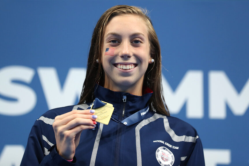 Gretchen Walsh holds her medal after winning the FINA Junior Swimming World Championships