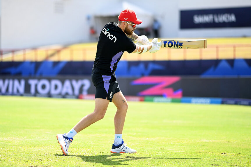 Phil Salt warms up playing Cricket on the field