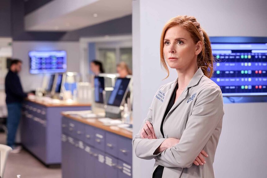 Dr. Pamela Blake stands in her white coat in Chicago Med Episode 716.