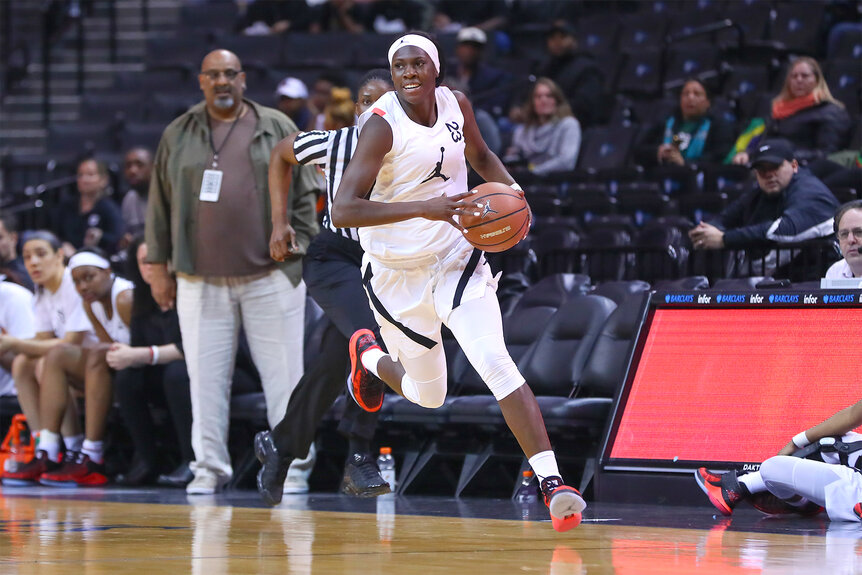 Rhyne Howard makes a play during a basketball game