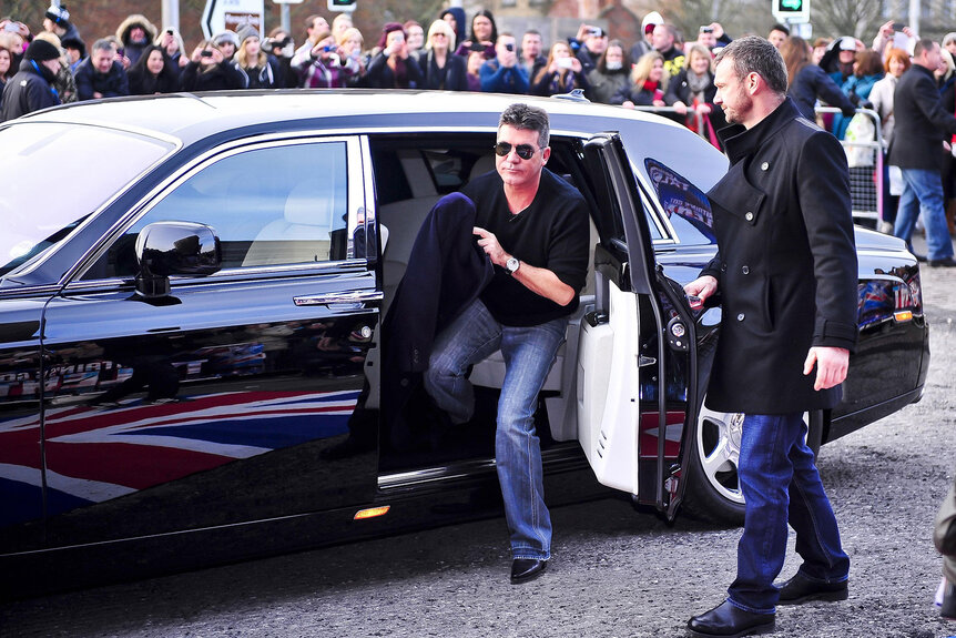 Simon Cowell gets out of a Rolls Royce