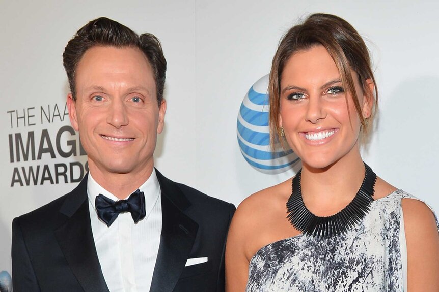 Tony Goldwyn and Anna Musky-Goldwyn pose together on a red carpet