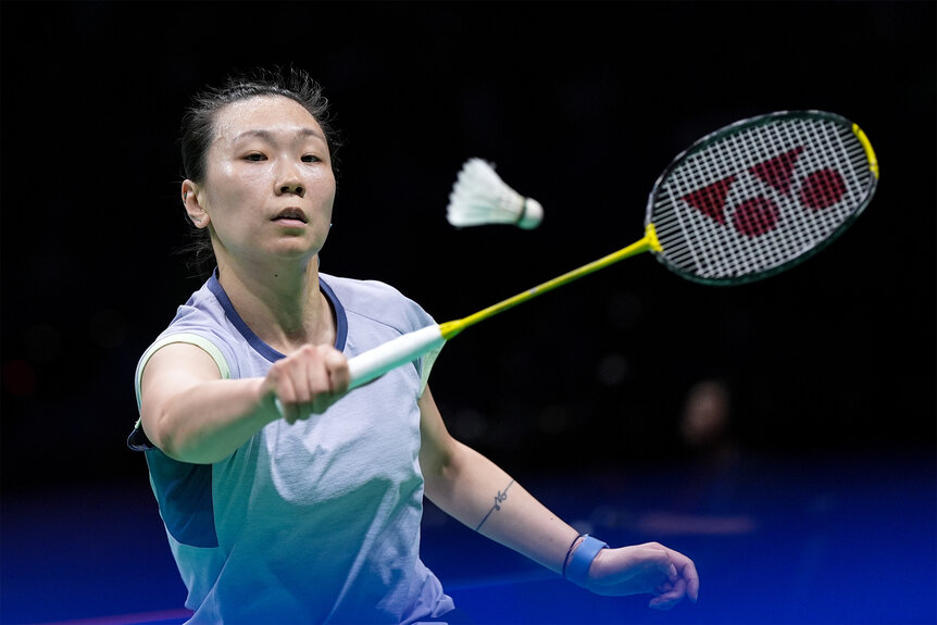 Beiwen Zhang hits the birdie duing a Badminton match