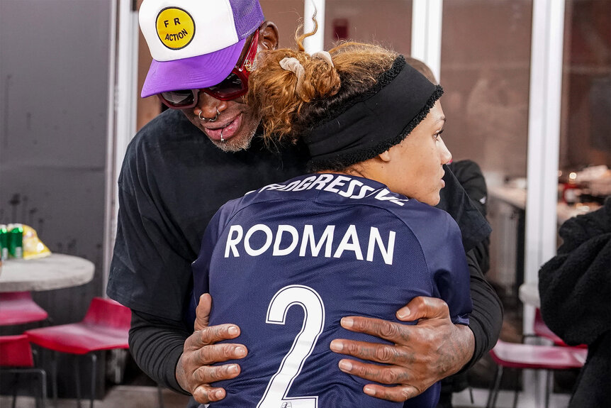 Trinity Rodman hugs her father Dennis Rodman after a game