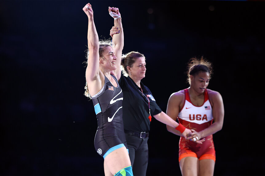 Helen Maroulis with her arms up celebrating after the US Olympic Wrestling Trials