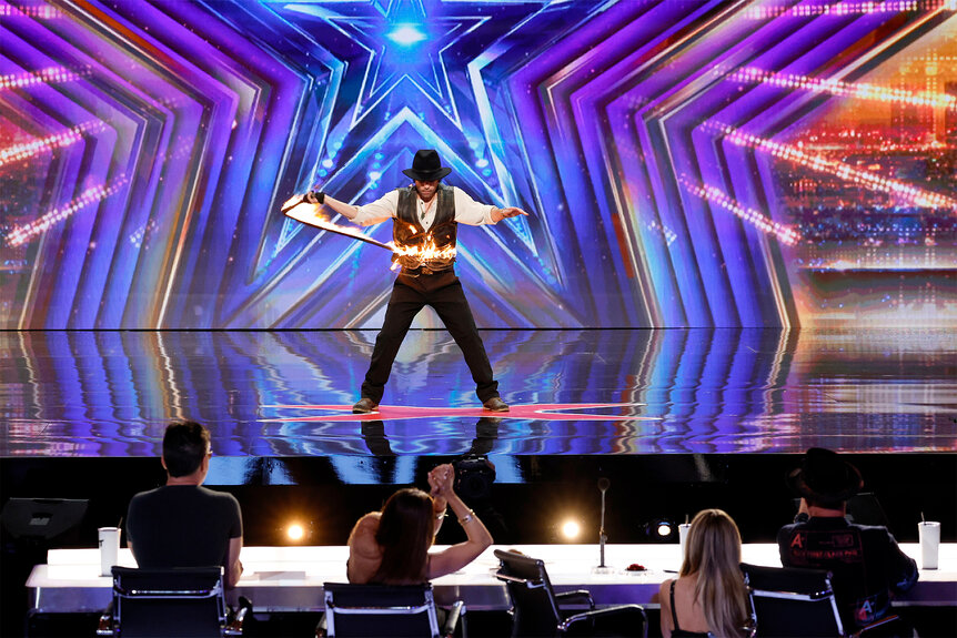 Tyler Burke performs on stage on America's Got Talent Episode 1906