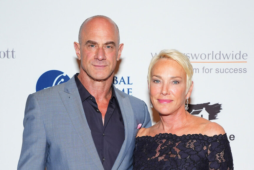 Chris Meloni and Sherman Williams posing together in front of a step and repeat.